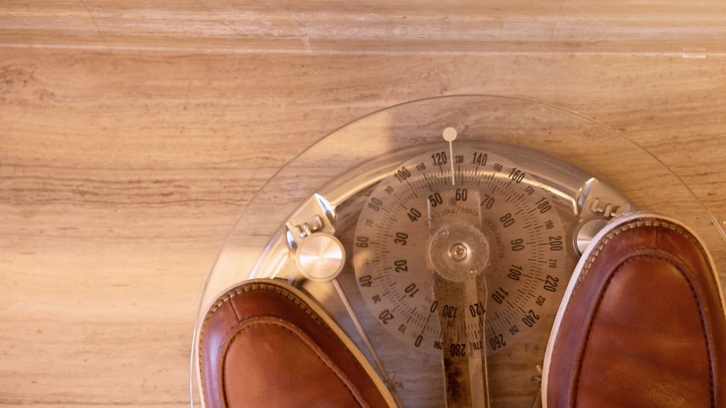 leather shoes on a weight meter 