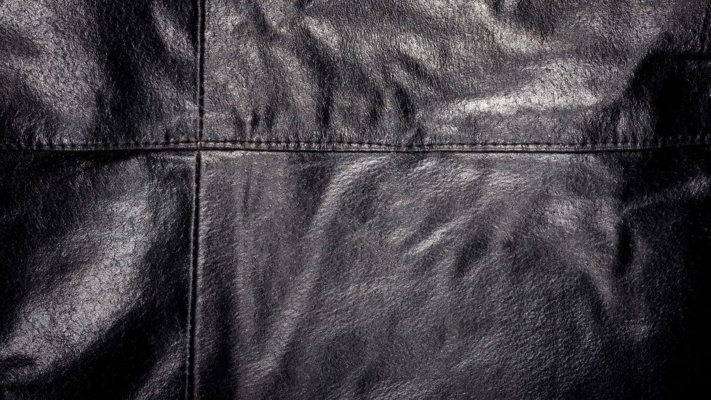 uneven seams and stitches on a leather jacket